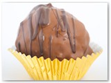 Sweet Sushi Black or White Cake Balls- Your choice of white or chocolate cake mixed with vanilla or chocolate icing, dipped in white or dark chocolate, drizzled with white or dark chocolate.